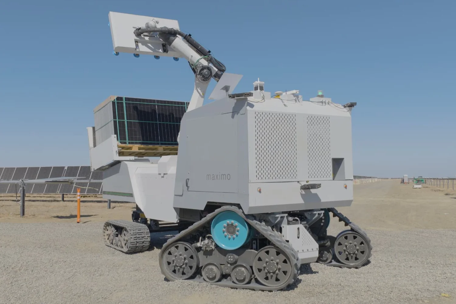 Maximo machine carrying solar modules across a utility-scale site